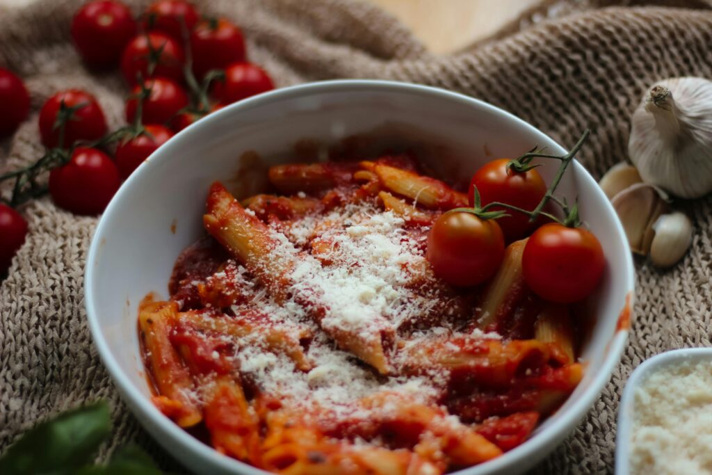 Tasty penne pasta in a rich tomato sauce, topped with parmesan cheese.
